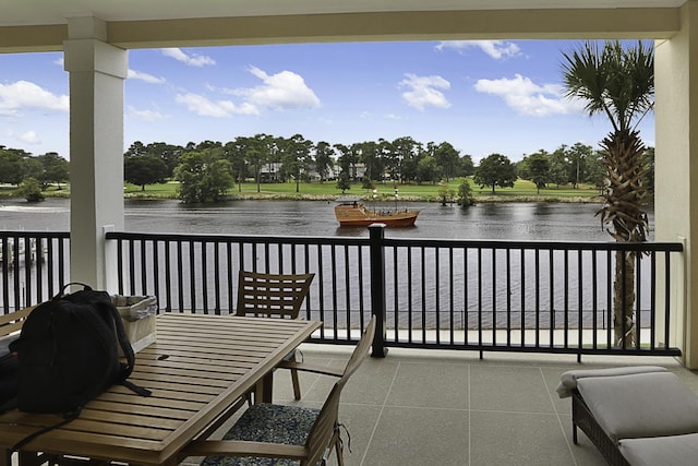 balcony featuring a water view