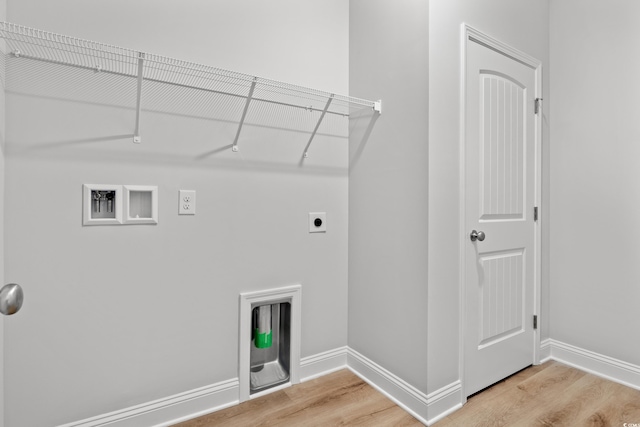 laundry room featuring light wood-type flooring, baseboards, hookup for an electric dryer, and laundry area