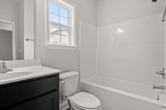 bathroom with washtub / shower combination, toilet, and vanity