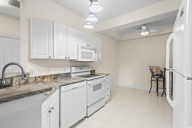 2241 Waterview Dr Unit 437, North Myrtle Beach, SC 29582 - kitchen featuring white appliances, white cabinetry, ceiling fan, and a tray ceiling