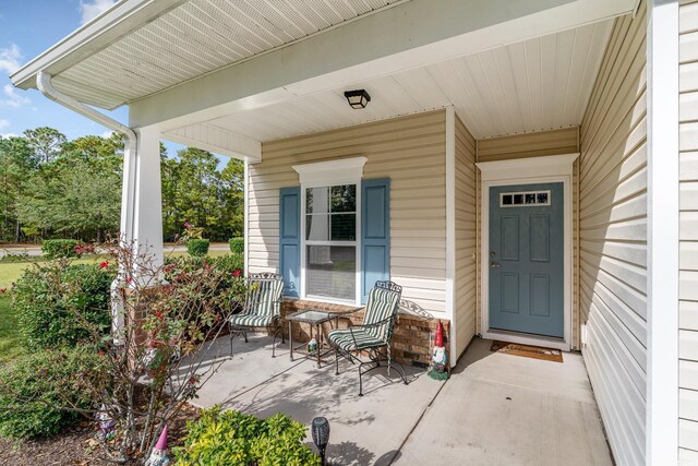 doorway to property with a porch