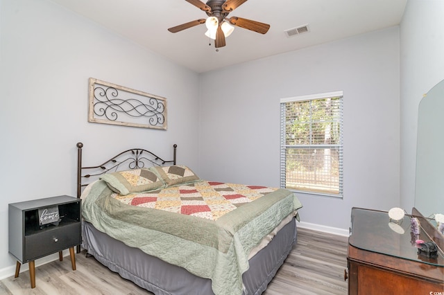 bedroom featuring wood-type flooring and ceiling fan