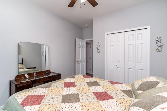 bedroom with ceiling fan and a closet