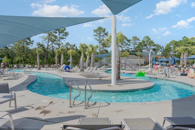 view of swimming pool featuring a patio area