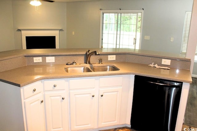 kitchen featuring ceiling fan, black dishwasher, sink, and white cabinets