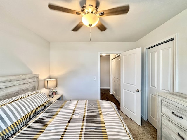 carpeted bedroom with a closet and ceiling fan