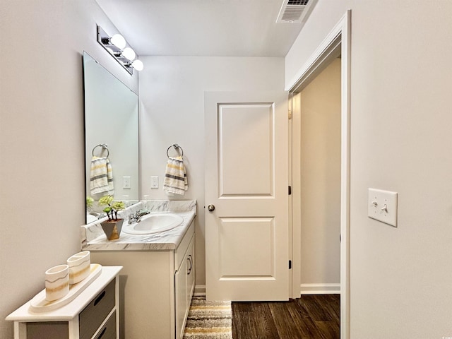 bathroom with vanity and wood-type flooring