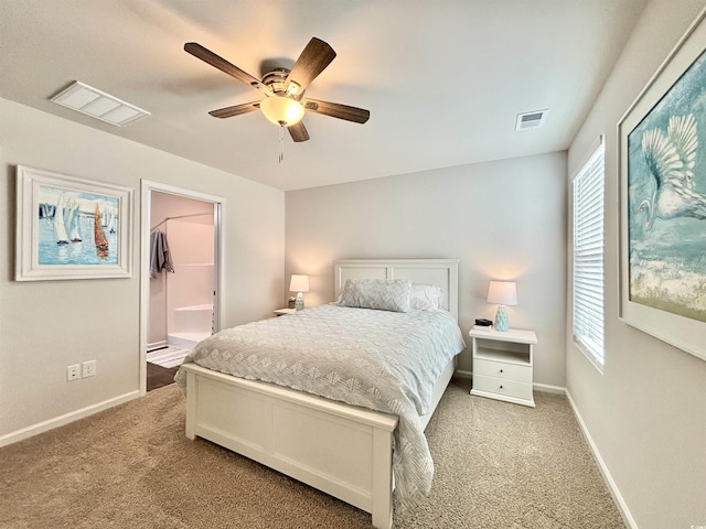 carpeted bedroom with a closet, a spacious closet, and ceiling fan