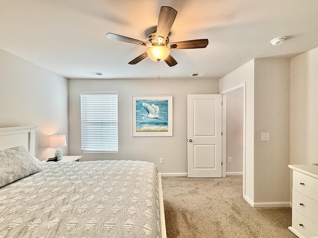 unfurnished bedroom featuring light carpet and ceiling fan