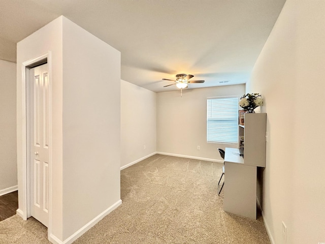 spare room with ceiling fan and carpet floors