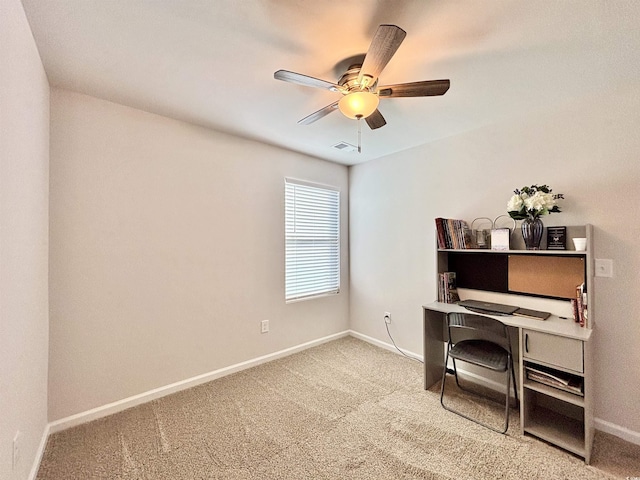 office space featuring carpet and ceiling fan