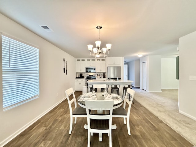 dining area featuring a chandelier