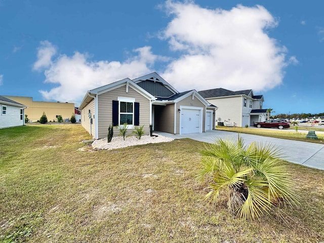 view of front of property with a garage and a front lawn