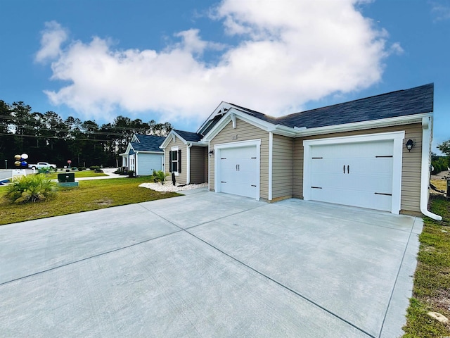 ranch-style house with a front yard and a garage