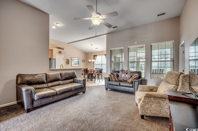 carpeted living room with ceiling fan, sink, lofted ceiling, and a healthy amount of sunlight