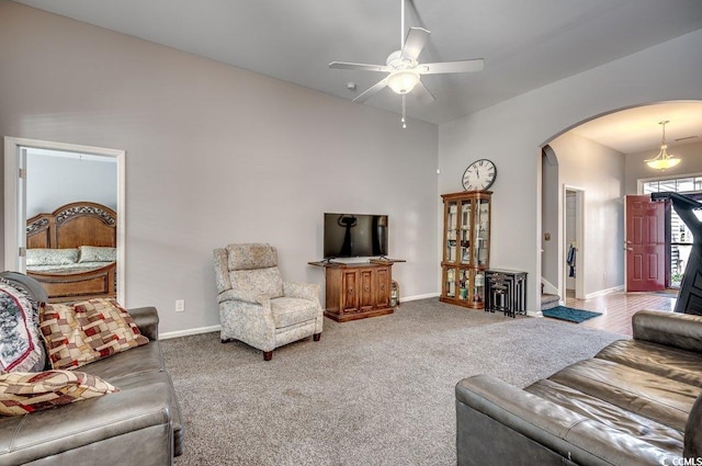 carpeted living room featuring ceiling fan