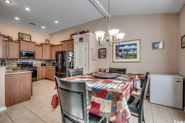 dining space with light tile patterned flooring, sink, a notable chandelier, and vaulted ceiling with beams