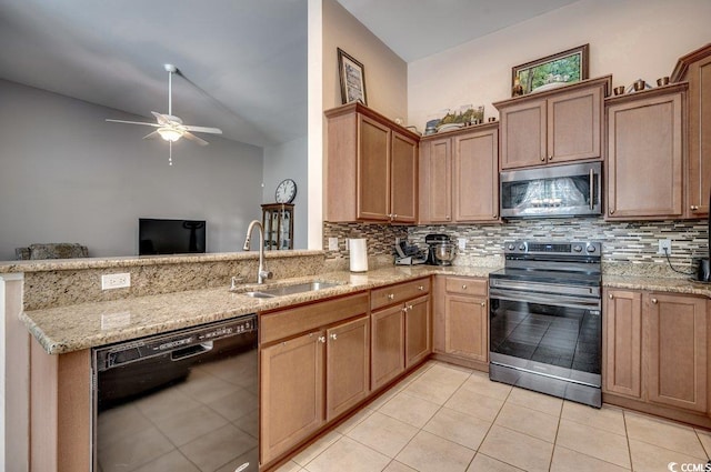 kitchen with sink, backsplash, lofted ceiling, and stainless steel appliances