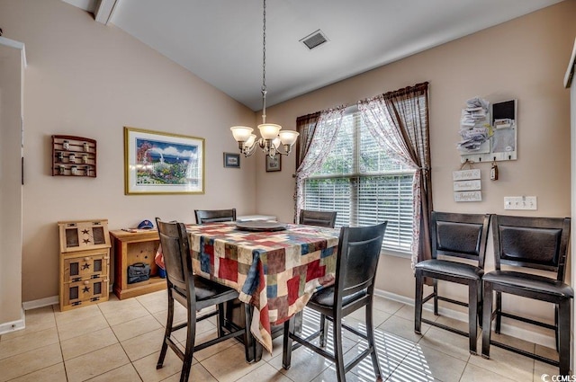 dining area featuring vaulted ceiling, an inviting chandelier, and light tile patterned floors