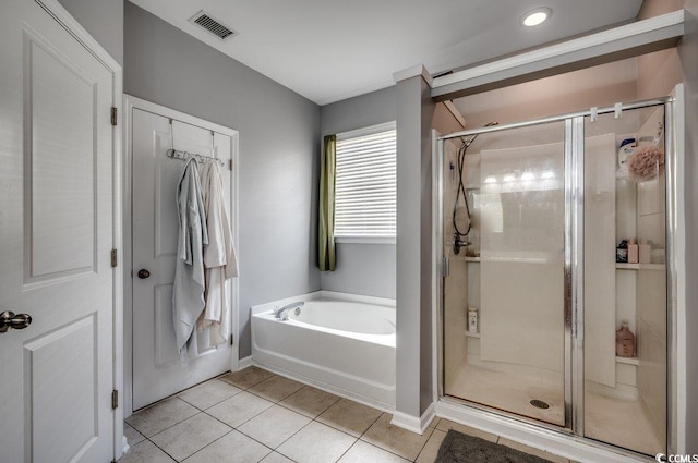 bathroom featuring tile patterned floors and plus walk in shower