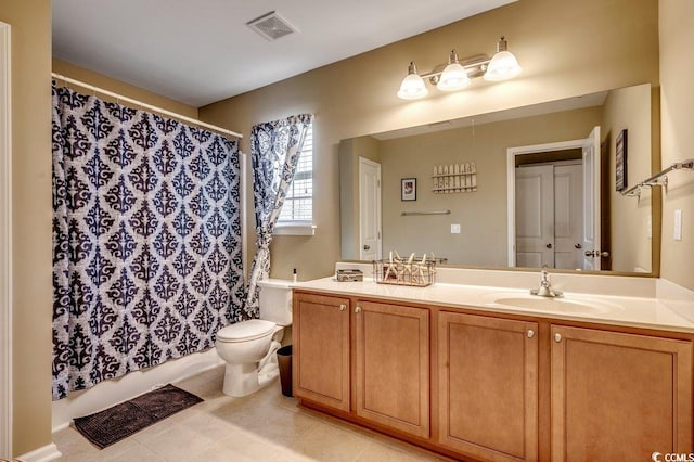 bathroom with tile patterned floors, vanity, and toilet