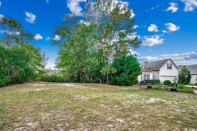 view of yard featuring a garage