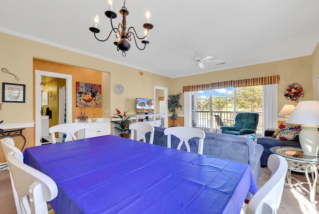 dining area with ceiling fan with notable chandelier, crown molding, and carpet floors