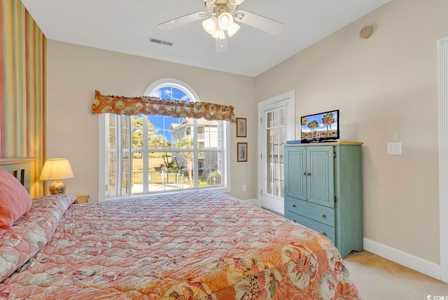 carpeted bedroom featuring ceiling fan and access to exterior