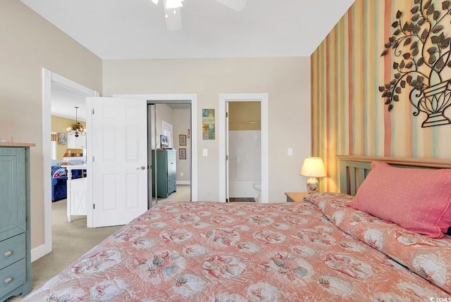 bedroom with carpet, ceiling fan, and ensuite bath