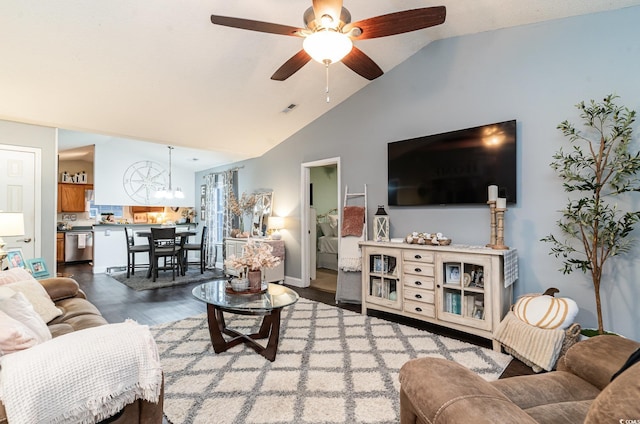 living room with dark hardwood / wood-style flooring, ceiling fan, and lofted ceiling