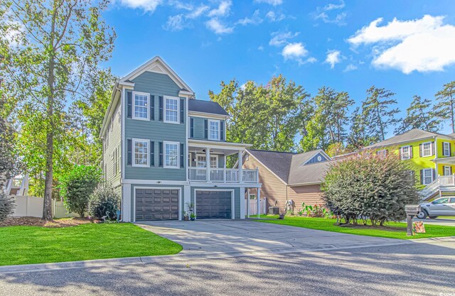 view of front of property featuring a garage and a front lawn