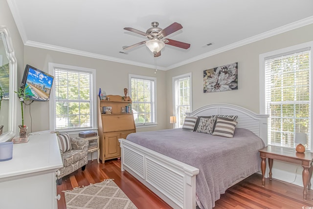 bedroom with ceiling fan, dark hardwood / wood-style floors, and crown molding