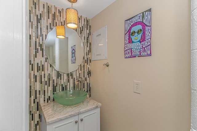 bathroom with vanity and backsplash