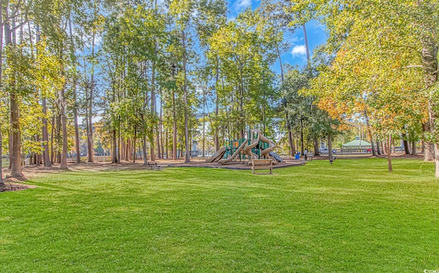 view of community with playground community and a yard