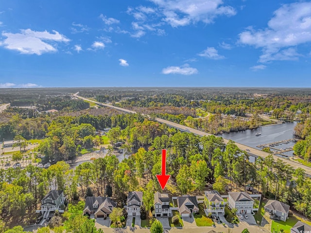 birds eye view of property featuring a residential view and a water view