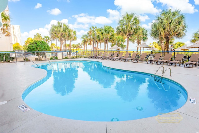 view of pool featuring a patio