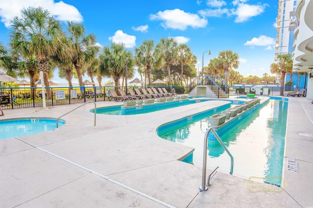 view of swimming pool featuring a patio area