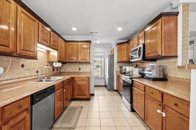 kitchen featuring sink, stainless steel appliances, backsplash, crown molding, and light tile patterned floors