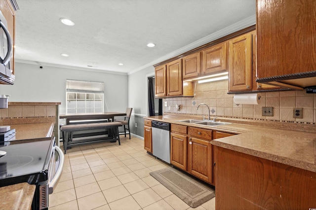 kitchen with sink, stainless steel dishwasher, crown molding, a textured ceiling, and light tile patterned floors