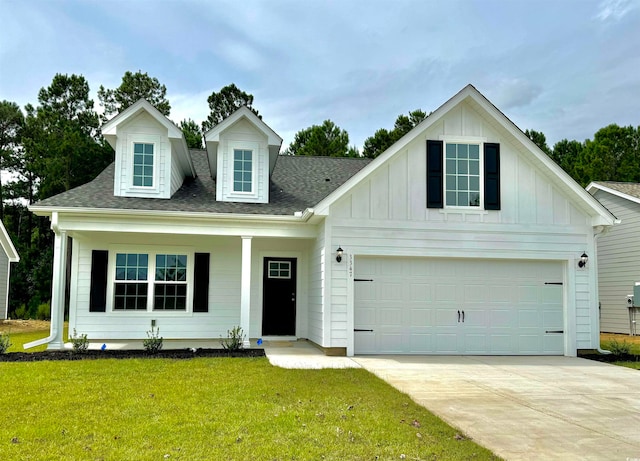 view of front of house featuring a front yard and a garage