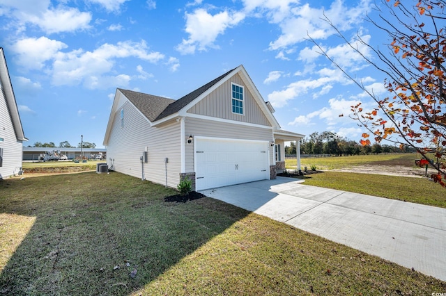 view of home's exterior featuring a garage, a lawn, and central AC