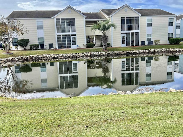 view of building exterior with central AC