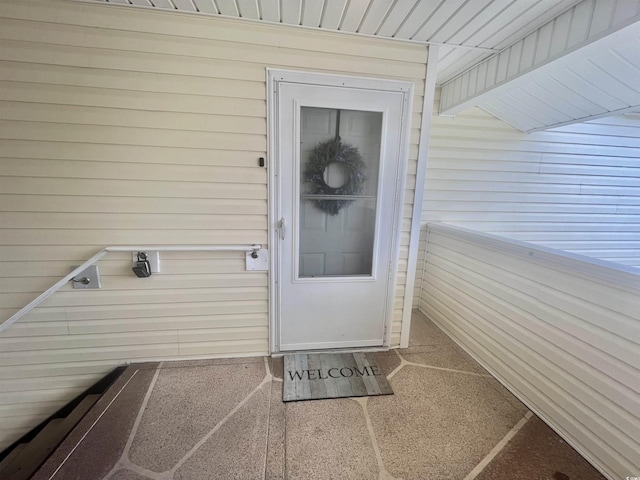 entrance to property with a balcony