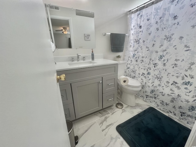 bathroom with toilet, marble look tiles, vanity, a ceiling fan, and curtained shower