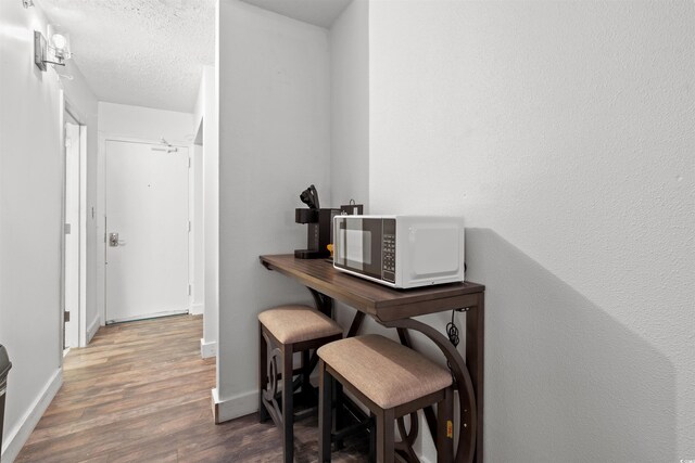 1501 Ocean Blvd S Unit 422, Myrtle Beach, SC 29577 - office space featuring wood finished floors, baseboards, and a textured ceiling
