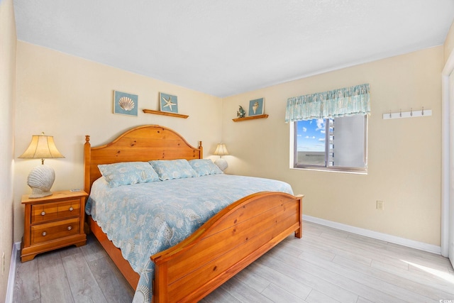 bedroom with hardwood / wood-style flooring