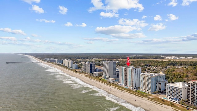 birds eye view of property featuring a water view and a view of the beach