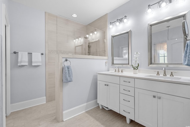 bathroom with a shower and vanity