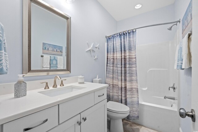 full bathroom with toilet, vanity, and shower / bath combo with shower curtain