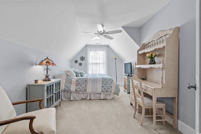 bedroom featuring light colored carpet, lofted ceiling, and ceiling fan